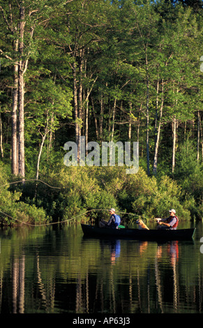 Freedom, NH Fly-fishing from a canoe in Trout Pond. Part of future town forest. (MR) Stock Photo