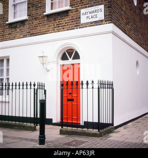 Red door, white house, black railing, Hayward's Place, Islington, London EC1   England, UK  KATHY DEWITT Stock Photo