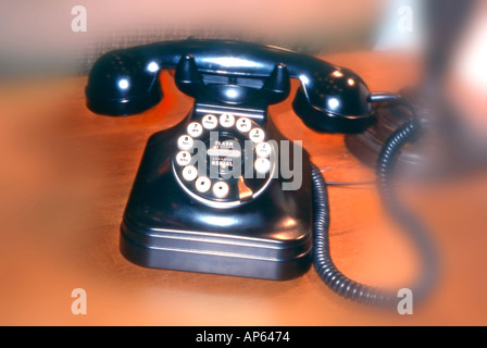 Blackold antique rotary dial telephone on desk in  hotel lobby Stock Photo