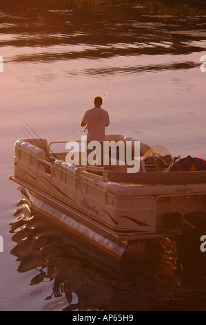 Saratoga Springs, NY, USA, man fishing at sunset on Saratoga Lake Stock Photo