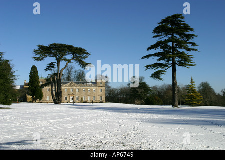 The mansion house and surrounding park of Lydiard Tregoze in the snow Stock Photo