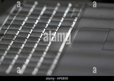 keyboard and mouse pad of Apple iBook portable computer Stock Photo
