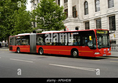 red arriva bendy bus travelling to trafalgar square in london england Stock Photo