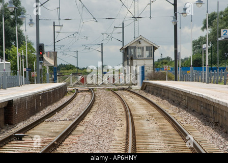 Track and platforms at littleport railway station, england showing passenger crossing area between platforms Stock Photo