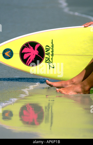 Surfer with surfboard on beach, Canary Islands, Spain, Stock Photo