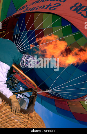 MAN INFLATING BALLOON Stock Photo - Alamy