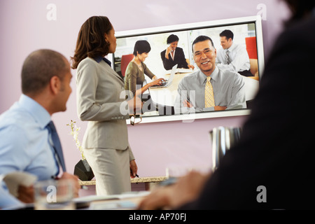 Multi-ethnic businesspeople having video conference Stock Photo