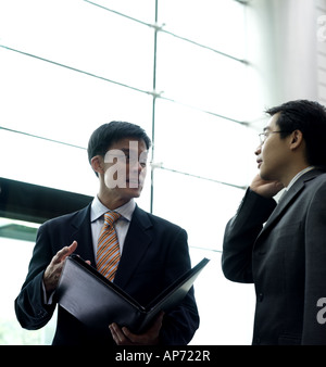 Two businessmen having discussion Stock Photo