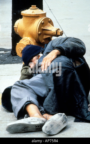 homeless man sleeping on street of LA, USA Stock Photo