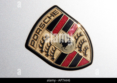 Porsche emblem on a car hood Stock Photo
