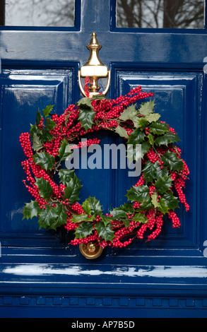 Christmas holly wreath on front door Stock Photo