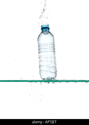 Bottle of water being dropped Stock Photo