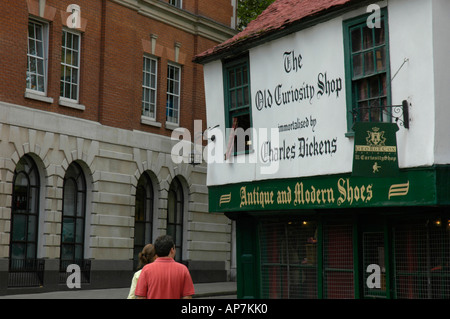 Tourists looking at the Old Curiosity Shop made famous by Charles Dickens London England Stock Photo