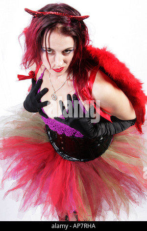Girl in a Tutu Net Stockings Black Basque Red Wings and Horns Stock Photo