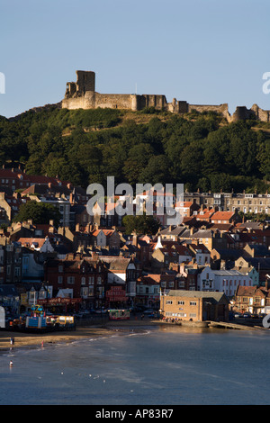 The Ruin of Scarborough Castle Looms Over The Town at Sunset Scarborough North Yorkshire England Stock Photo