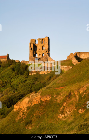 The Ruin of Scarborough Castle at Sunset from North Bay Scarborough North Yorkshire England Stock Photo