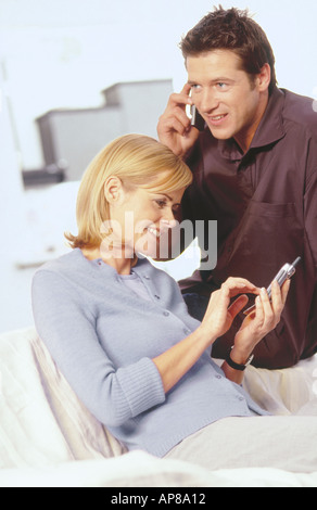 Young couple using mobile phones Stock Photo