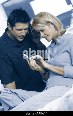 Young couple using mobile phones Stock Photo