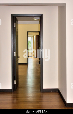 Looking down the hall through a series of doorways in a vacant apartment Stock Photo