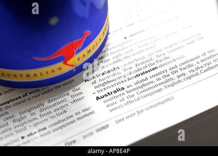 The Oxford English Dictionary showing the meaning of the world Australia with a Fosters Beer can Stock Photo