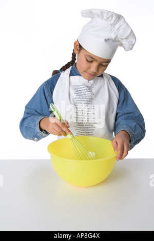 Girl is making batter for cakes Stock Photo - Alamy