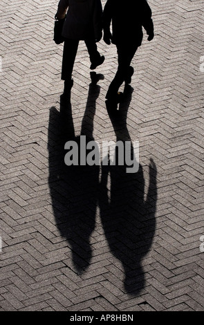 silhouette of shoppers walking in Birmingham Stock Photo