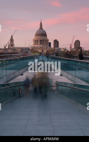 Even Saint's Blush - Millenium bridge at sunset with St Pauls Cathedral in the background Stock Photo