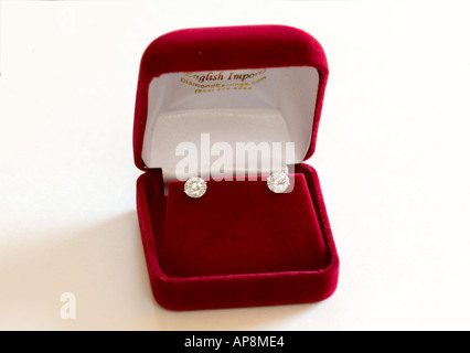 Diamond stud Earrings set in a red velvet gift box Stock Photo