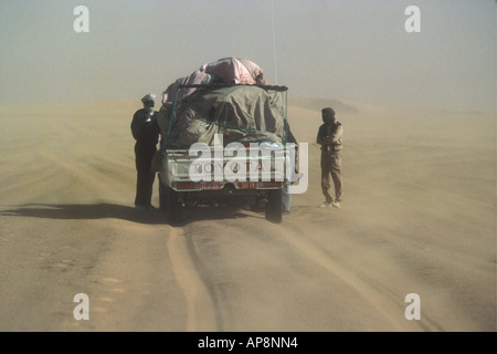 Lone pickup truck crossing on the Erg du Djourab sand dunes in the Sahara desert northern Chad Stock Photo