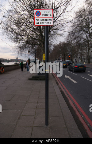 A post with a RED ROUT NO STOPPING sign on a street in London. Stock Photo