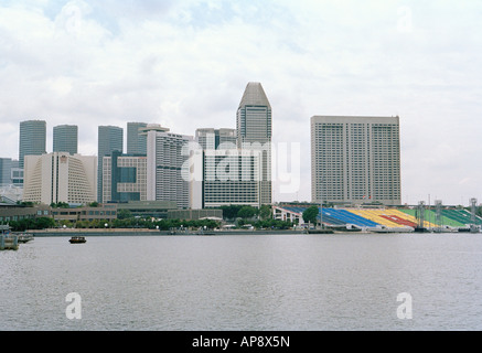 Watefront view of Marina, Marina Promenade, Mandarin Oriental hotel, and Suntec City mall on an overcast day; Singapore Stock Photo