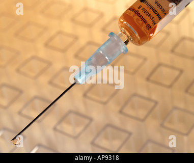 Adding blood samples to test containers for analysis - DNA fingerprinting Stock Photo