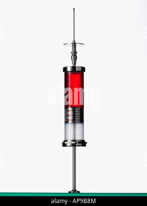 Syringe containing red liquid Stock Photo