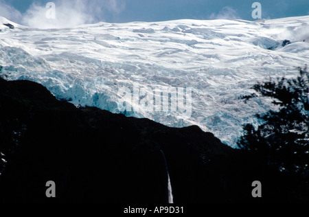 Wonderous glacial ice formation with waterfall Mt Rob Roy Glacier Mt Aspiring National Park South Island New Zealand Stock Photo