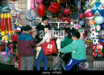 Chinese people children buying toys shoppers shopping at toy store in capital city of Kunming, Yunnan Province, China, Asia Stock Photo