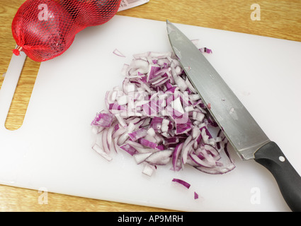 Red onions on the chooping board. Stock Photo