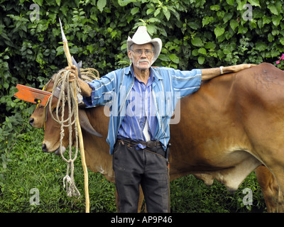 Senior man with traditional oxcart in San Jose, Costa Rica, Central America Stock Photo