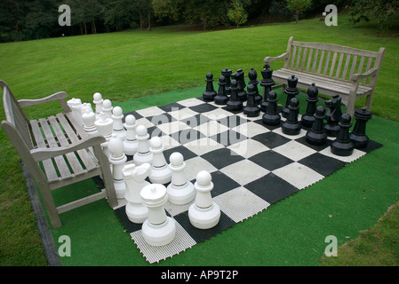 Giant chess set in garden Stock Photo