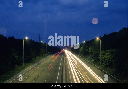 Light streaks on the A2 at night with a full moon added