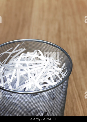 wire bin with shredded paper Stock Photo