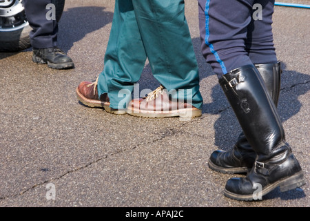 Feet of two police officers and a man whom they are testing for driving under the influence. Stock Photo