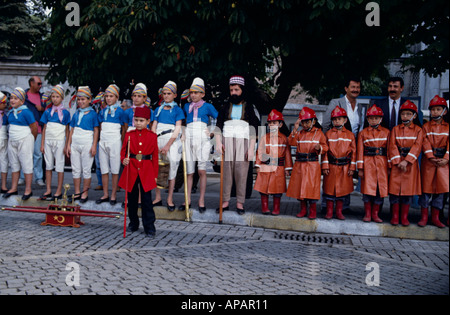 Children Dressed up as  Ancient Chachters and Fire Cadets  Topkapi Palace Istanbul Turkey Stock Photo