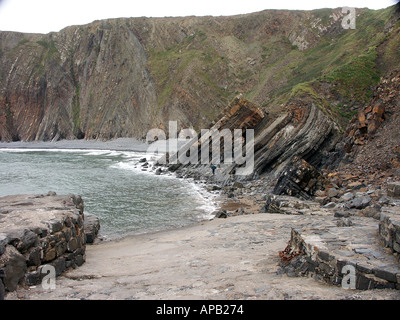 Geological formations at Hartland Quay in Devon.  Strata beach waves and sea visible. Stock Photo