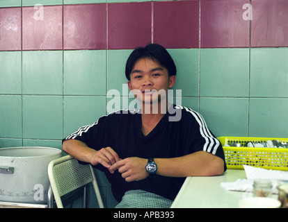 A young waiter in a cafe in Kuching East Malaysia Stock Photo