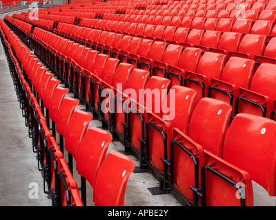 United Kingdom Manchester rows of red stadium seats at Manchester United Stock Photo