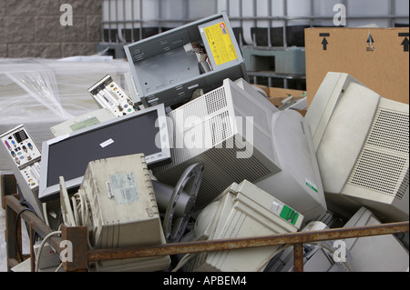 pile of discarded pc computer components including system boxes and tft monitor waiting to be recycled Stock Photo