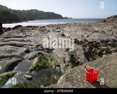 bucket beach and rocks combe martin north devon Stock Photo