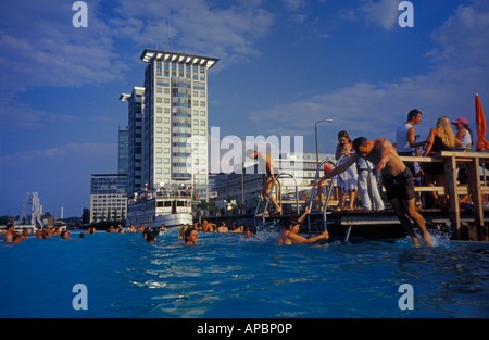 Berlin. Badeschiff an der Arena in Treptow. A swimming pool in the river Spree. People swimming. Stock Photo