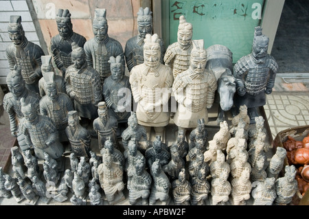 Miniature terracotta warriors in neat display at market stall, Xian, China Stock Photo