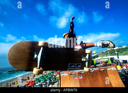 Mid-air skateboarding action on ramp at Rip Curl Board Masters, Newquay, UK, August 2001 Stock Photo